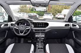 Volkswagen Tacqua white side view showroom